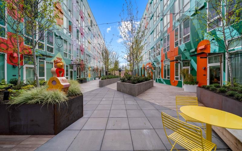 a courtyard with plants and benches