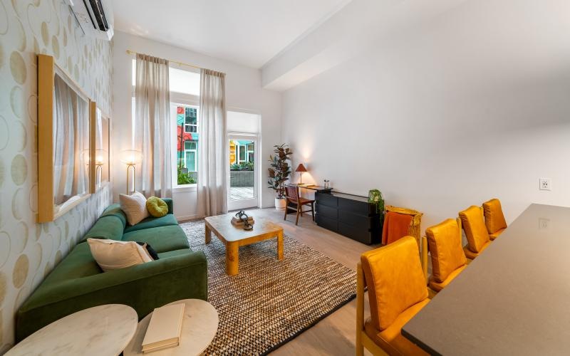 a living room with a green couch